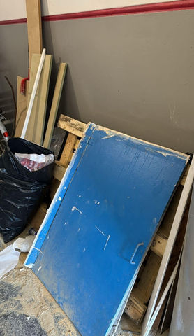blue panel door with other wooden waste