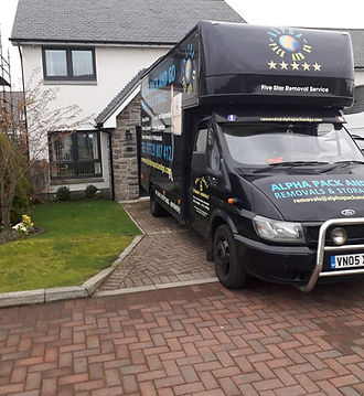 black truck in front of a house