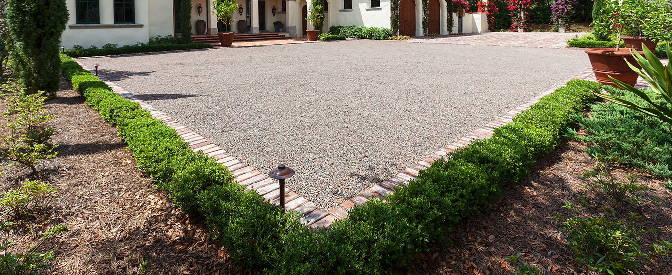 driveway and green grass outside the house