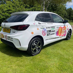 side view of white car