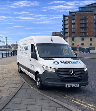 front view of white van on road