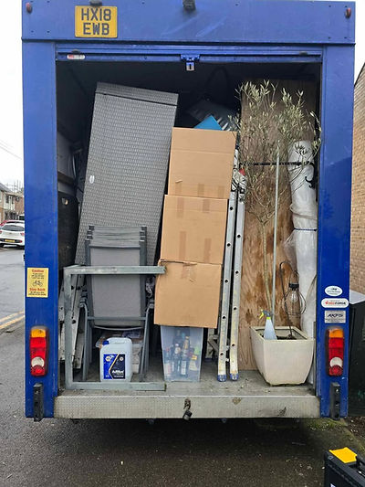 rear view of a truck which is filled with various items
