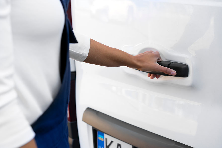 A person's hand while opening van door