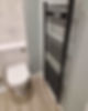 black rail radiator on wall