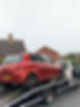 red car on a tow truck