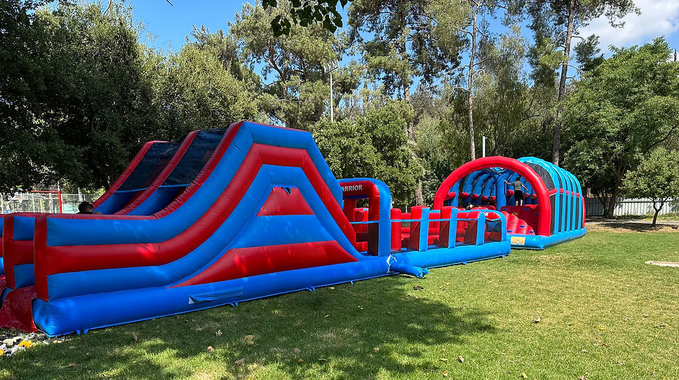 Wide angle view of a giant inflatable slide at a community event