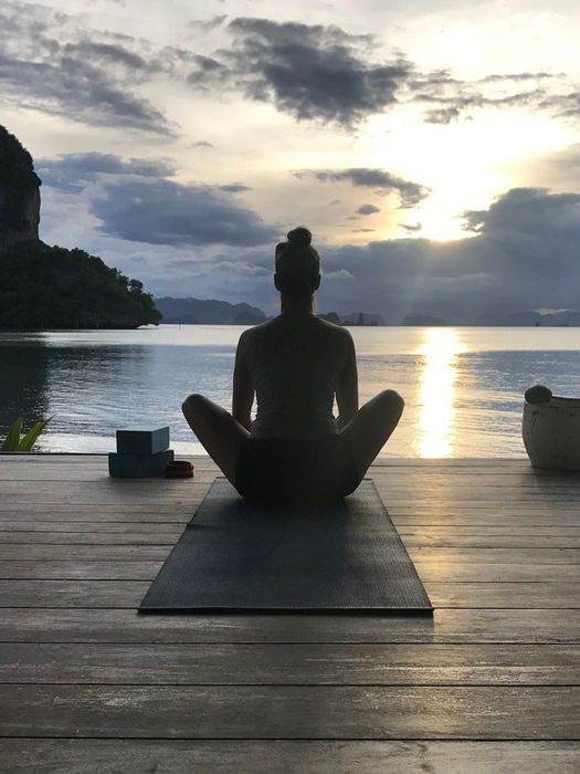 Jenna sitting in a yoga pose