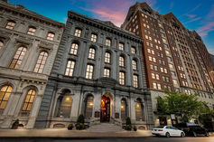 Three mid-rise buildings at sunset