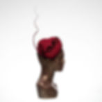side view of dark pink heart shaped hat with dramatic quill