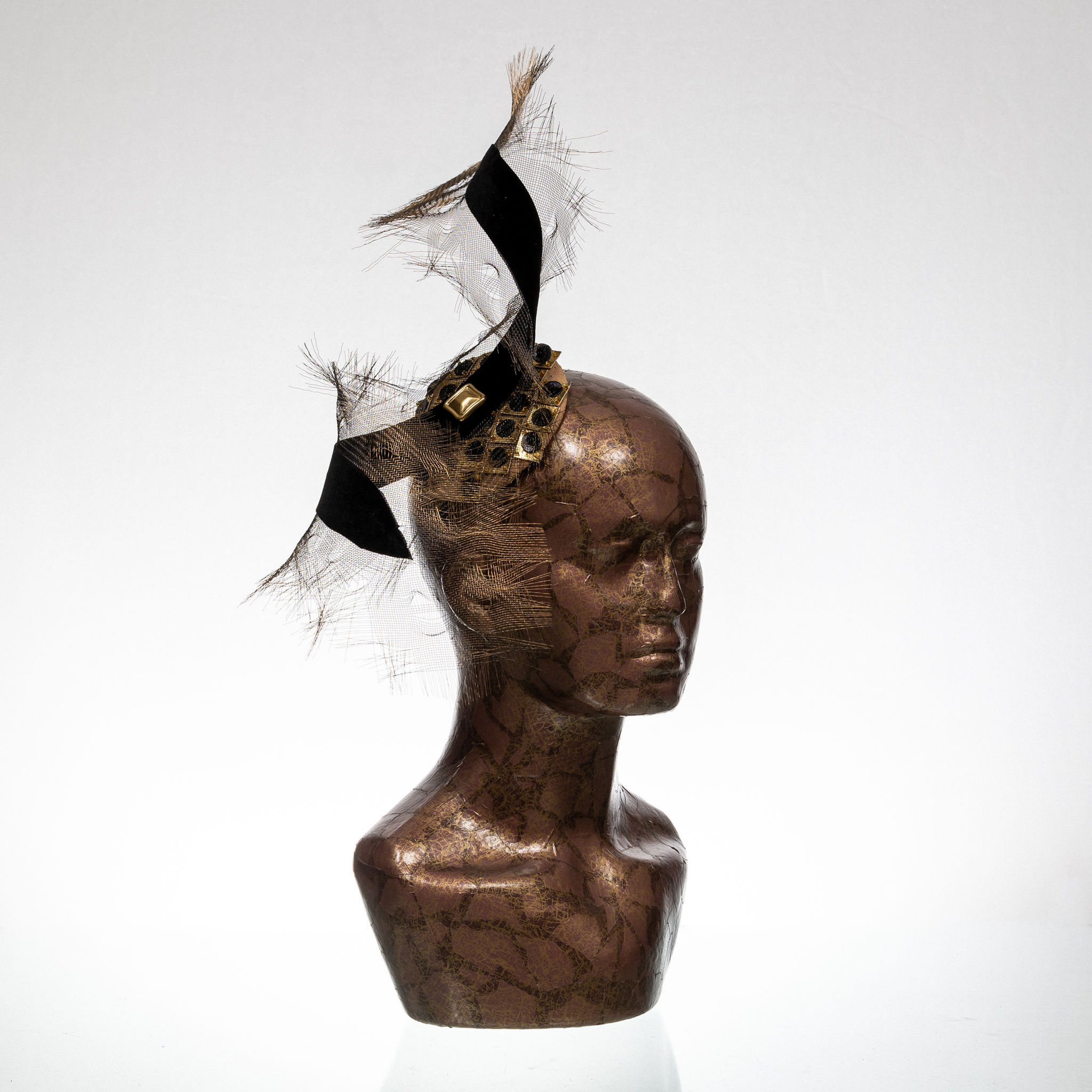 Quarter view black and gold modern fascinator, fashion