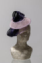 Modern, unique, one of a kind, lilac and purple sculptural spiral hat for the races or a wedding guest, quarter view