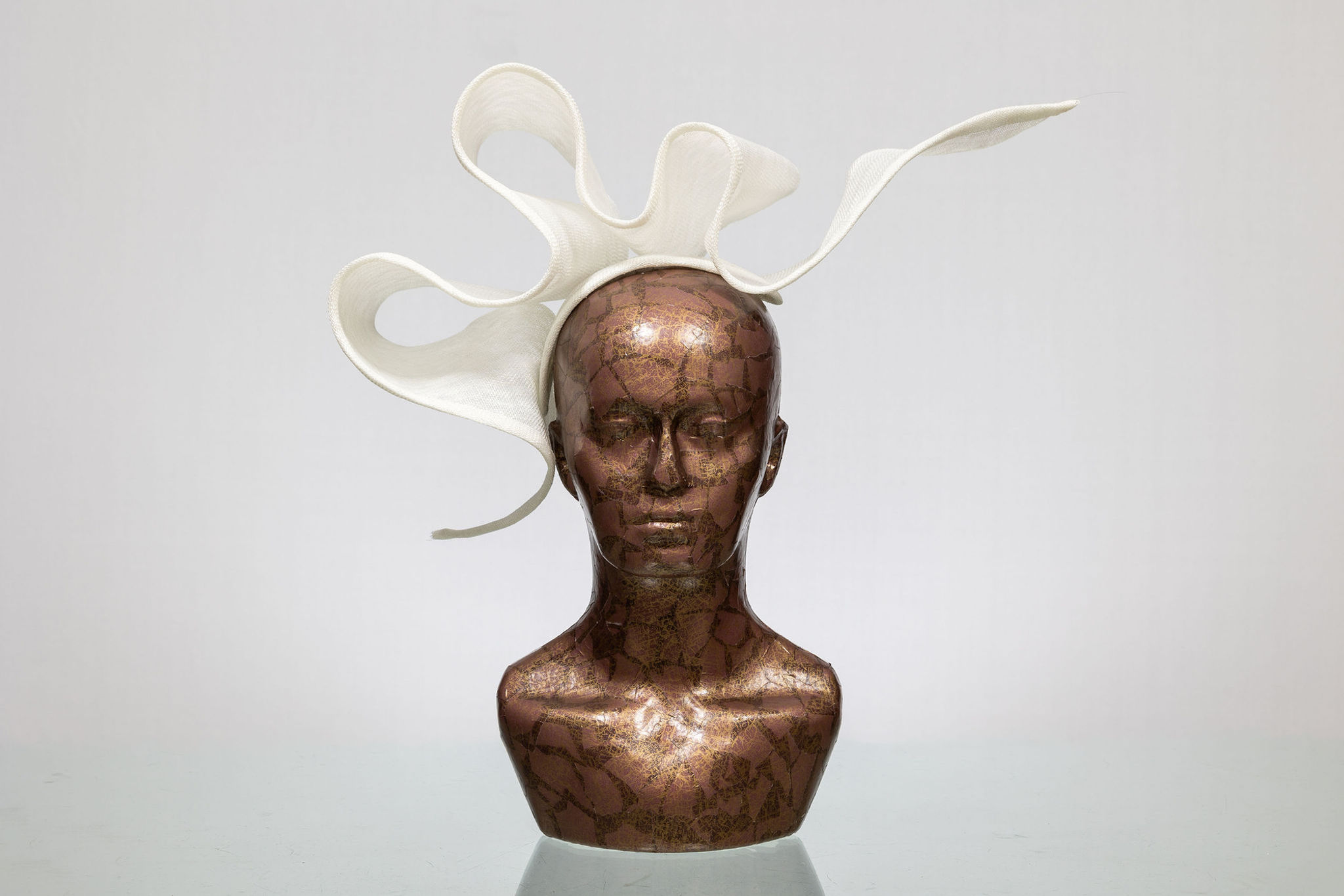 front view of large modern sculptural white fascinator