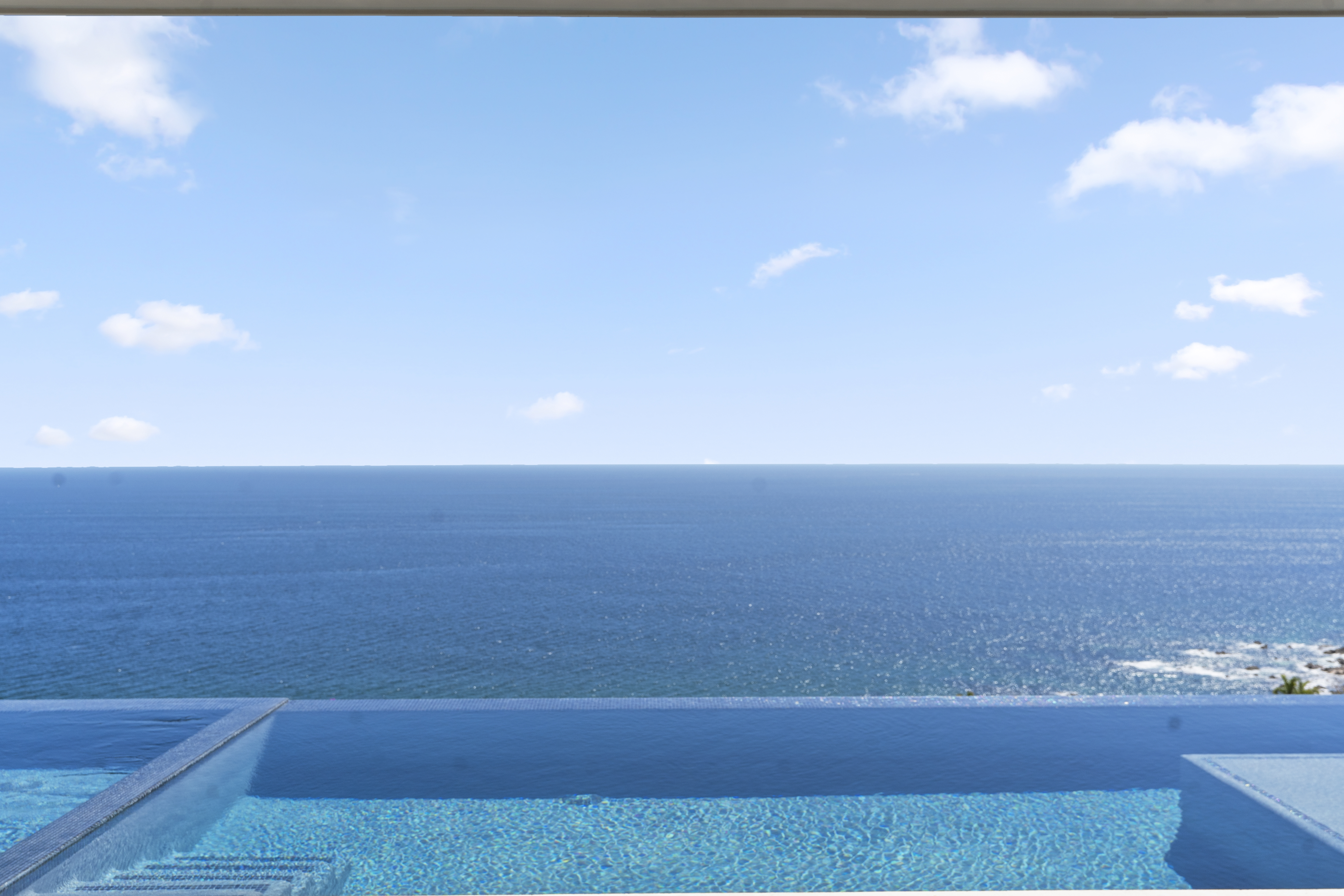 Infinity pool and ocean at Reserva