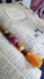 Beaded tassel keychain on antique book