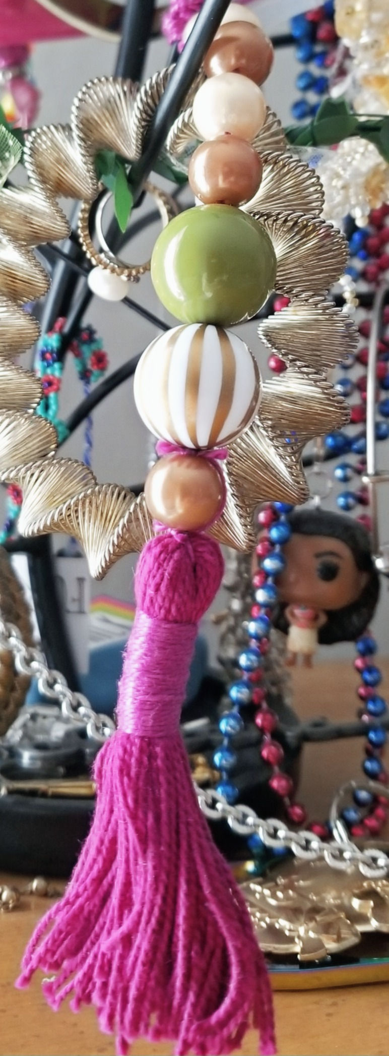 Close-up of fuchsia yarn wrapped pendant