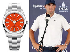 Scottie Scheffler wearing his Rolex Oyster Perpetual with red dial