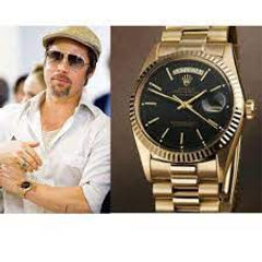 Actor Brad Pitt wearing his Rolex Day Date President with Black Dial