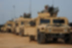 Convoy of fully armored turbo charged humvees