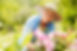 Senior-woman-with-flowers-in-garden-148278999_2122x1415.jpeg