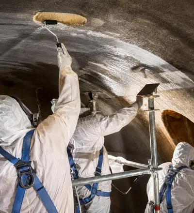 Plastech Services, Inc. OSHA compliant confined space certified relining an Industrial Fiberglass FRP Tank. FRP Tank Reline Project. 