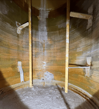 Fiberglass tank before repair