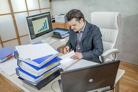 young-businessman-working-from-his-office-concept-hard-work.jpg