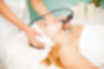 Close-up of microneedling treatment being performed on facial skin