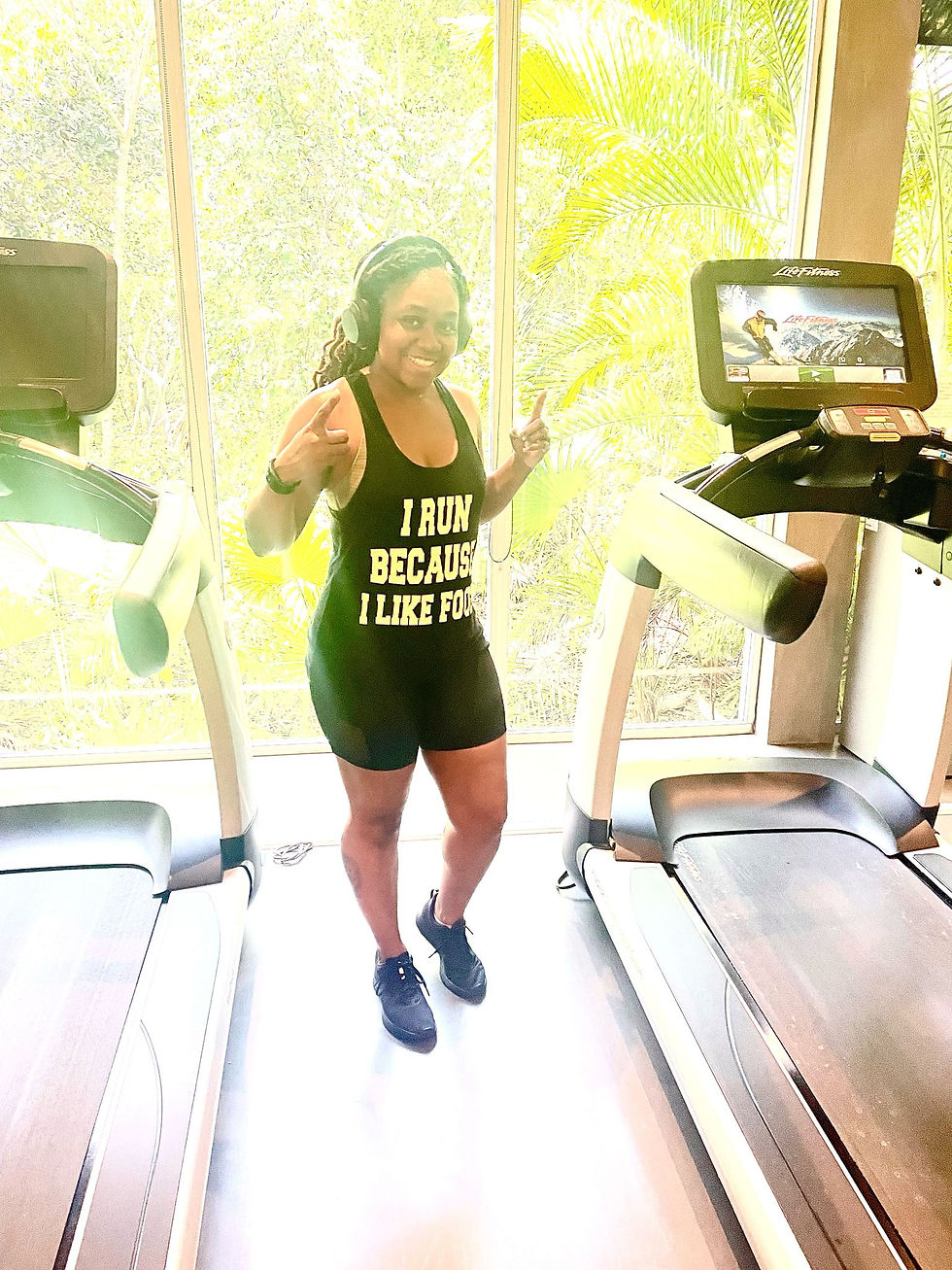 Coach Dee standing confidently in GEM Nutrition Coaching tank top, representing women's gut health empowerment