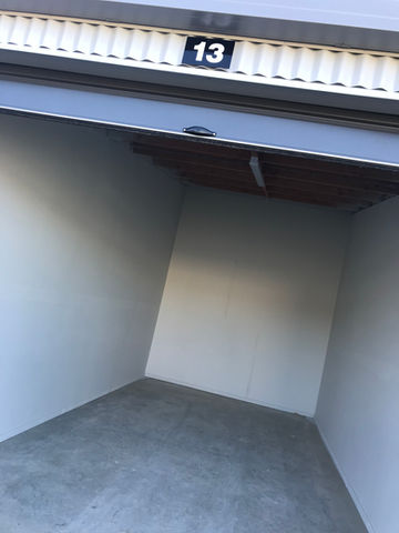 Clean, dry interior of large 6m × 3m self storage unit with concrete floor in Richmond.