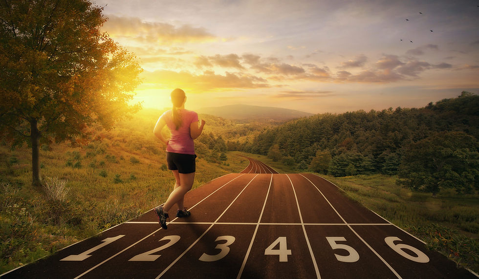 a-woman-runs-on-a-track-through-the-valley_S7EMXJflA-SBI-301081168-scaled.jpg