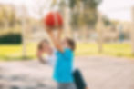 brothers-playing-basketball-court.jpg