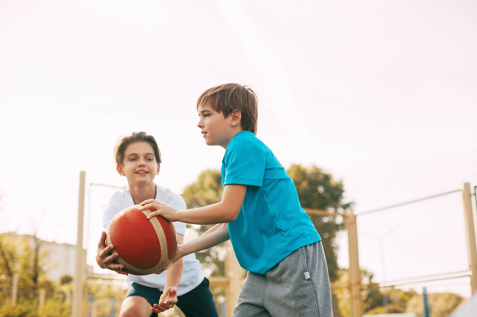 boys-playing-basketball-against-clear-sky.jpg