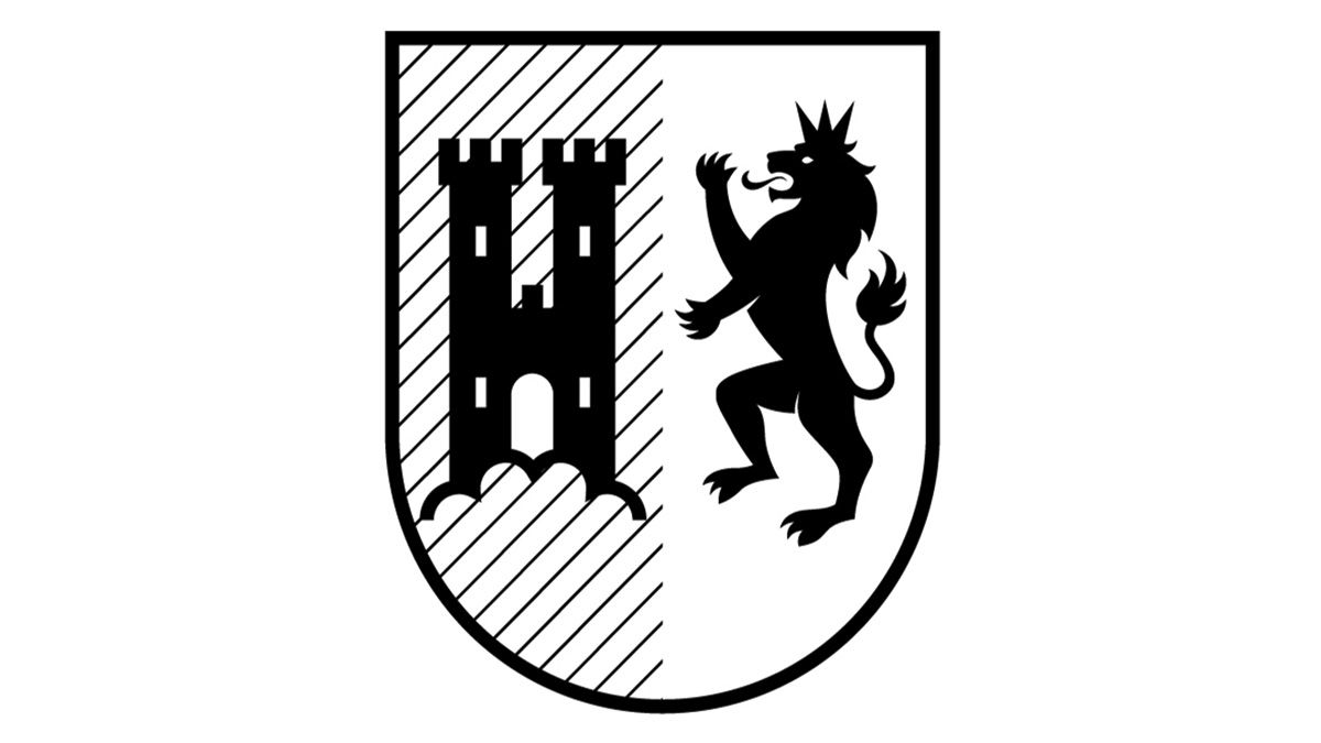 Wappen zeigt mittelalterliche Burg mit Zinnen. Rechts aufrecht tanzender Löwe