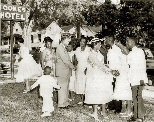 Photo: Dorothy Nash Tookes greeting guests in front of her hotel after her son's wedding, 1958. (photo courtesy of Florida Memory Project, State Library and Archives of Florida)
