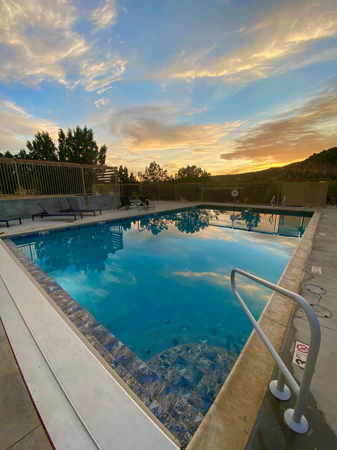 Sun setting over the original East Zion Resort swimming pool.