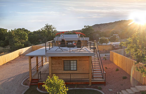a wood slatted tiny house with rooftop deck at East Zion's tiny house Resort