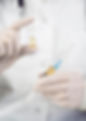front-view-doctor-with-surgical-gloves-holding-medication-syringe.jpg
