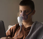 view-teenage-boy-using-nebulizer-home-respiratory-health-problems (1).jpg