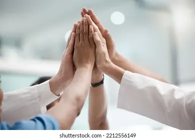 high-five-teamwork-doctors-hands-260nw-2212556149.jpg