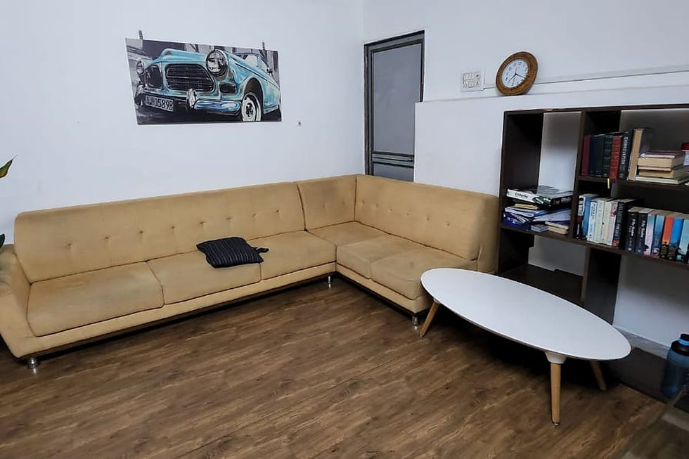 Lounge area at a rehab near me with a tan sectional sofa