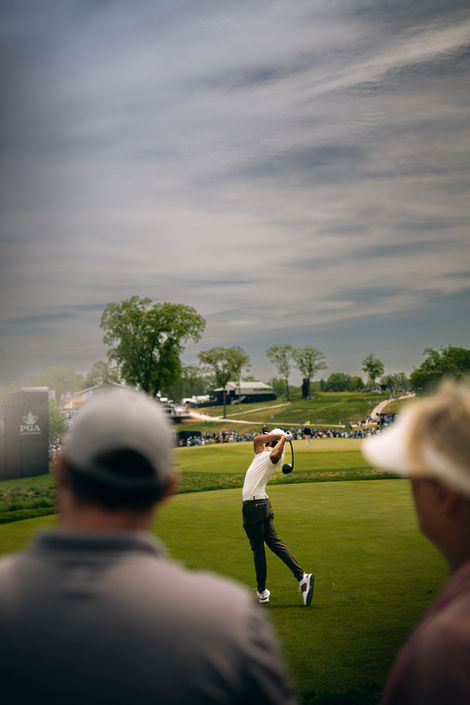 A photo of a PGA golfer teeing off during the PGA Championship at Aronimink  Golf Club. Taken by Philadelphia based lifestyle photographer Joshua Dahl.