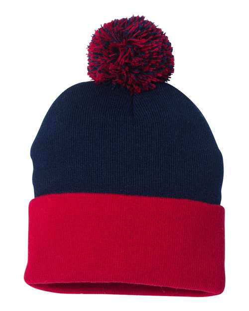Thumbnail: Navy blue beanie with red brim and pom-pom, perfect winter apparel.