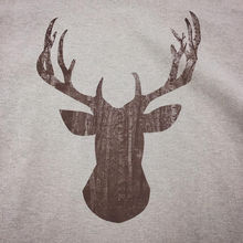 Deer silhouette with woods as filler. 