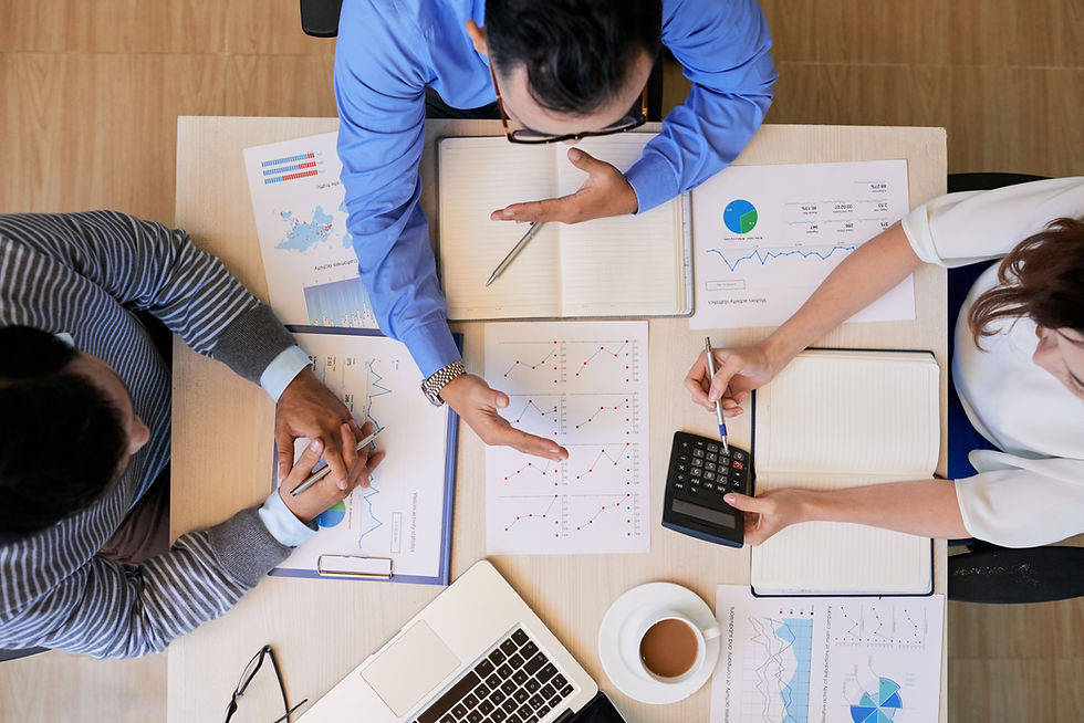 overhead-of-coworking-people-at-table-2025-02-11-13-53-16-utc.jpg