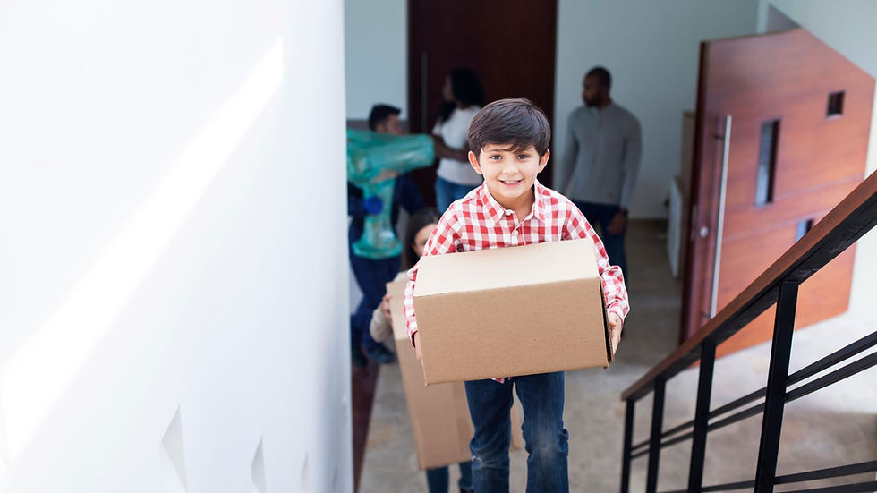 A picture of a happy child entering their new home