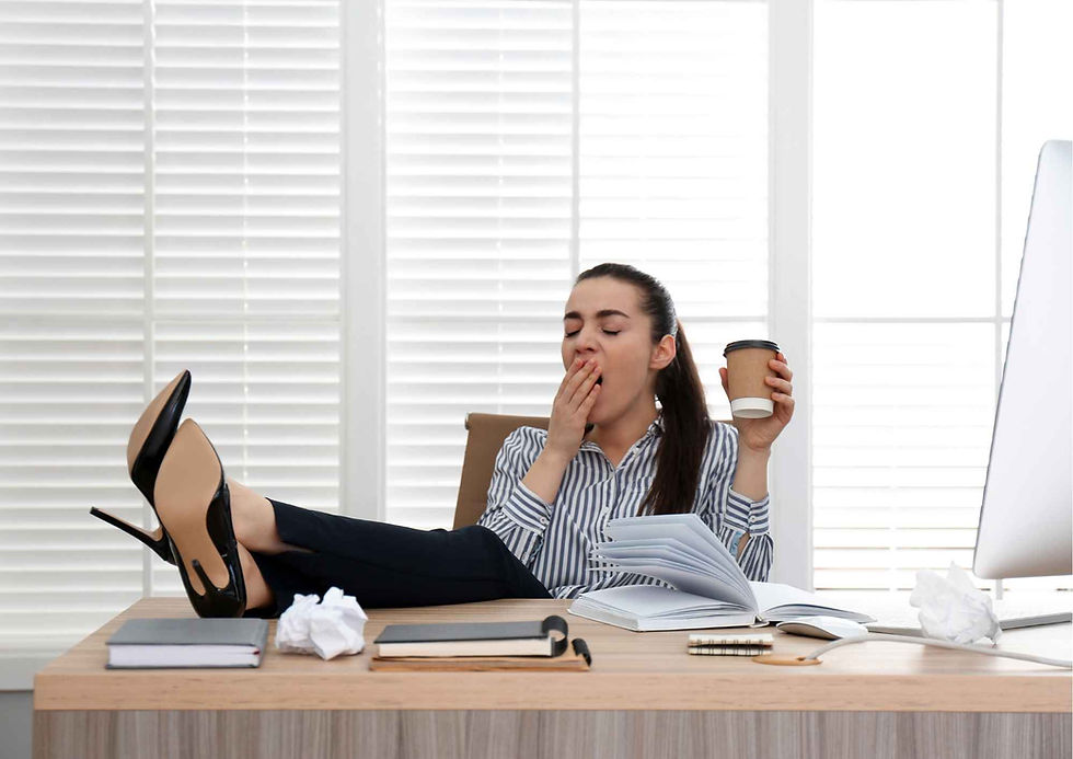 A lazy Employee yawning and putting her feet up