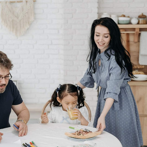 A foster family eating tea