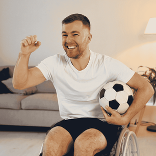 A happy Football fan in a Wheelchair