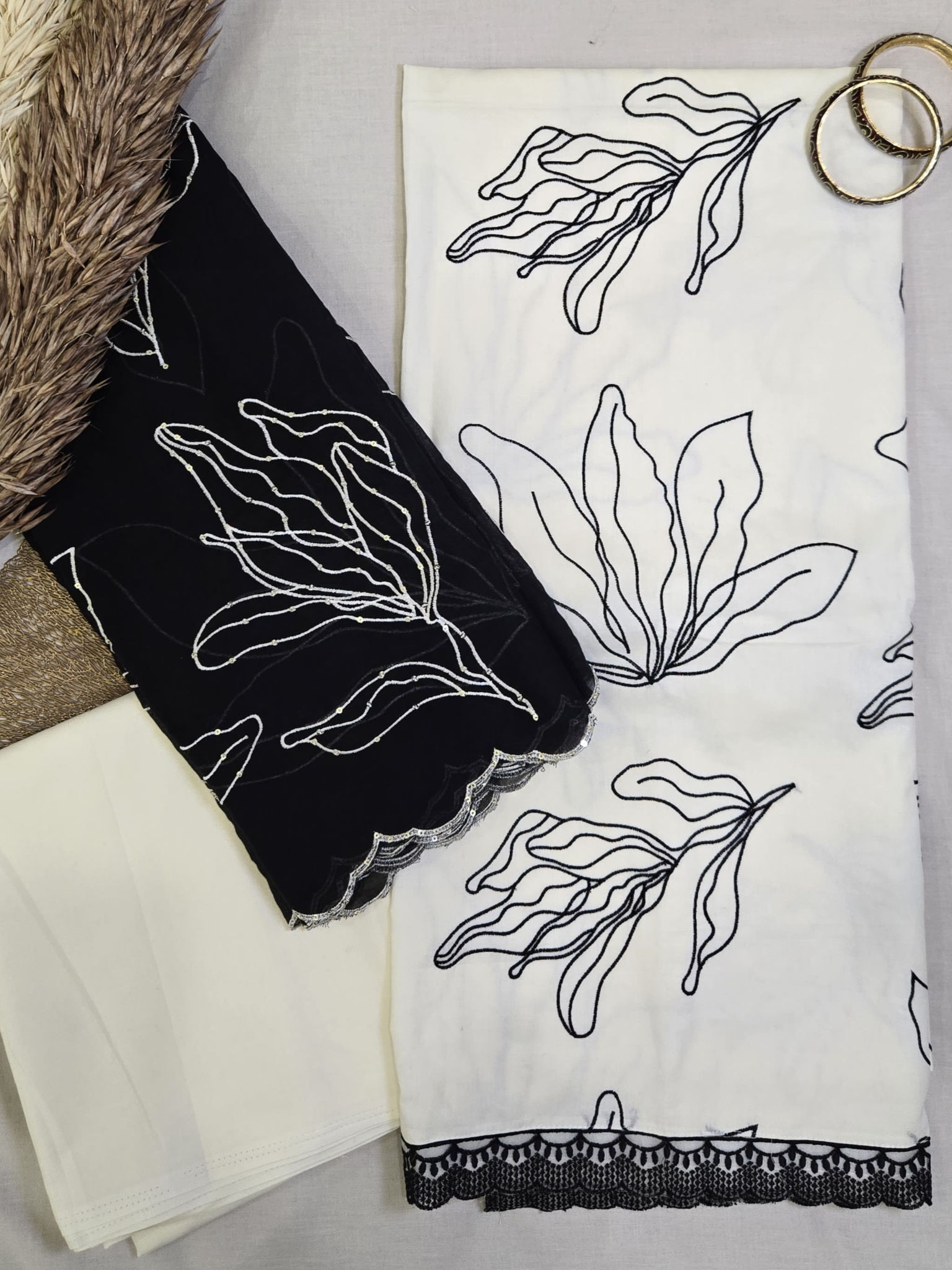 White Suit with Black Floral Design