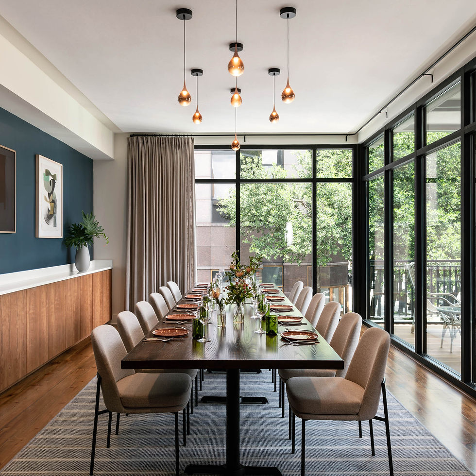 Private dining room with twenty seating with windows overlooking oak trees at Copper Vine Winepub.